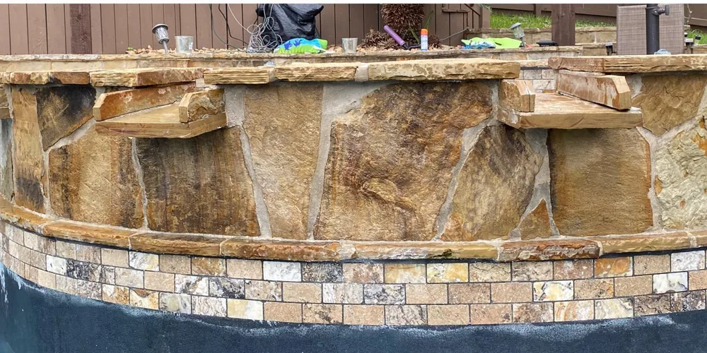 After: restored natural stone spa coping