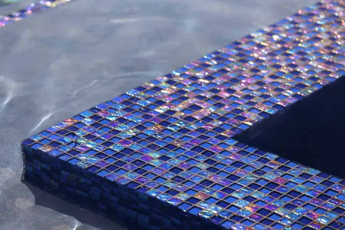 Waterline tile kept clear of calcium and hard-water scale
