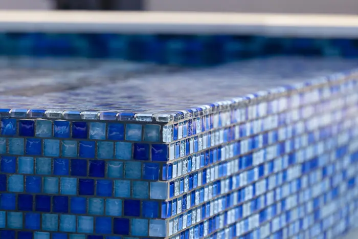Clean glass waterline tile after professional cleaning